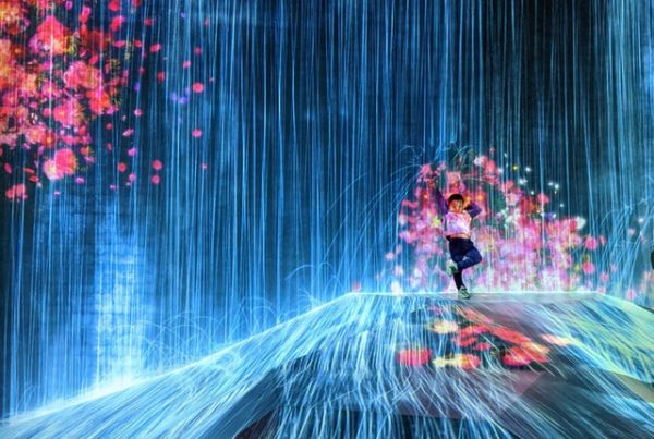 Surreal digital art picture of young boy splashed by flowers